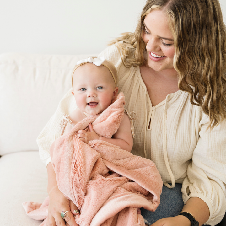 The Blossom Saranoni Lush Receiving Blanket is cozy and soft, ideal among best blankets for toddlers.