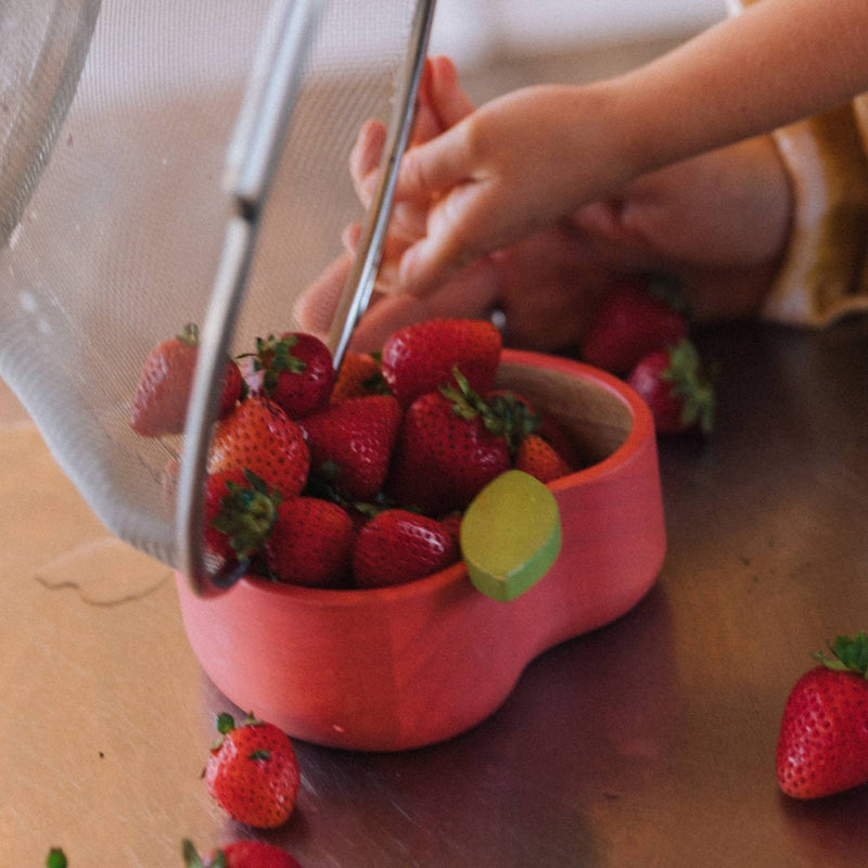 red strawberries in oli and carol wooden apple bowl for toddler 
