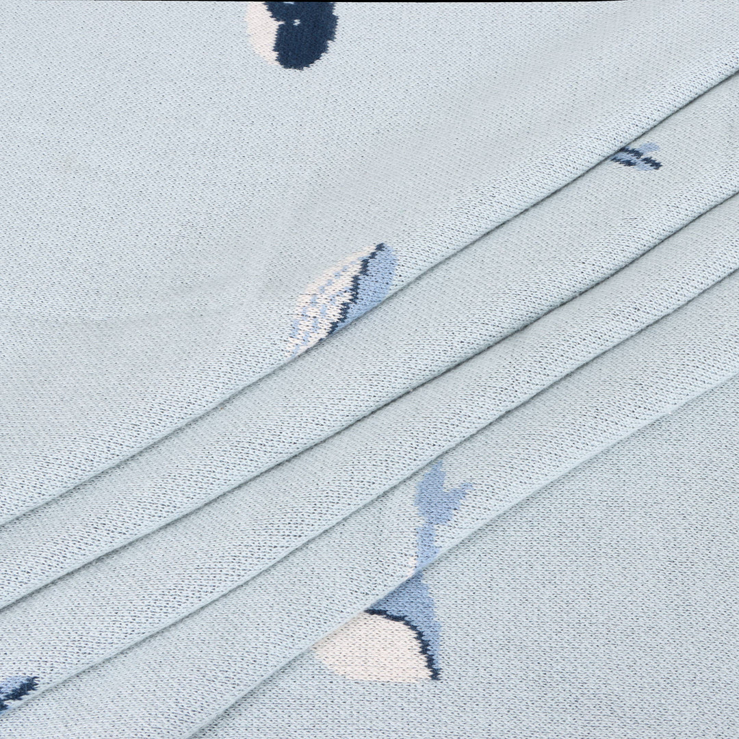 Wrap toddlers in Viverano Organics Whales Baby Blanket, a soft toddler blanket perfect for play or quiet rest.