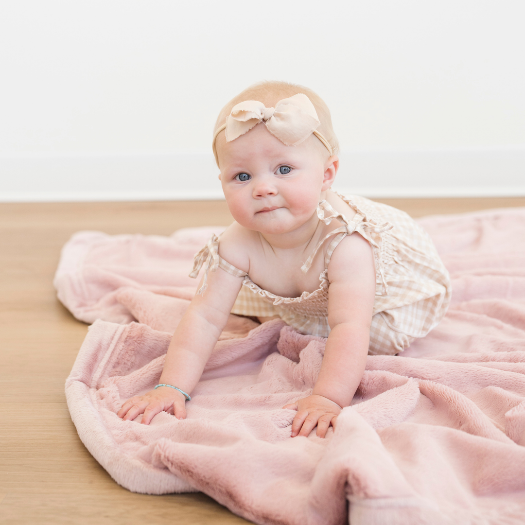 Ultra-soft Ballet Slipper Lush Receiving Blanket by Saranoni makes nap time warm and comfy as baby receiving blankets.
