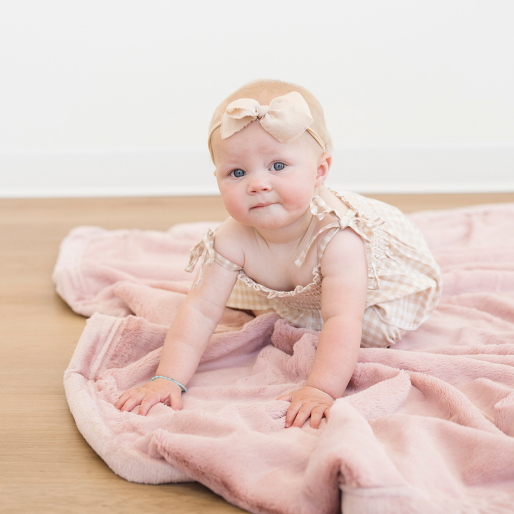 Ultra-soft Ballet Slipper Lush Receiving Blanket by Saranoni makes nap time warm and comfy as baby receiving blankets.