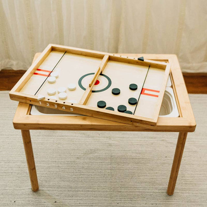 Sling a Ling Hockey Game by Wonder and Wise overhead view showing playing field built in scorekeeper and pucks