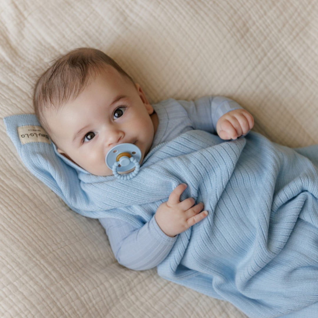 Twins wrapped in beige Bleu La La Organic Ribbed Knit Cotton Baby Blankets in woven Moses basket, organic ribbed knit receiving blankets for infants