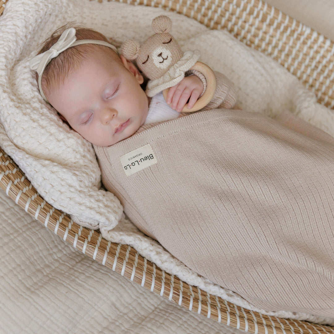 Baby swaddled in beige Bleu La La Organic Ribbed Knit Cotton Baby Blanket, soft breathable newborn ribbed knit blanket