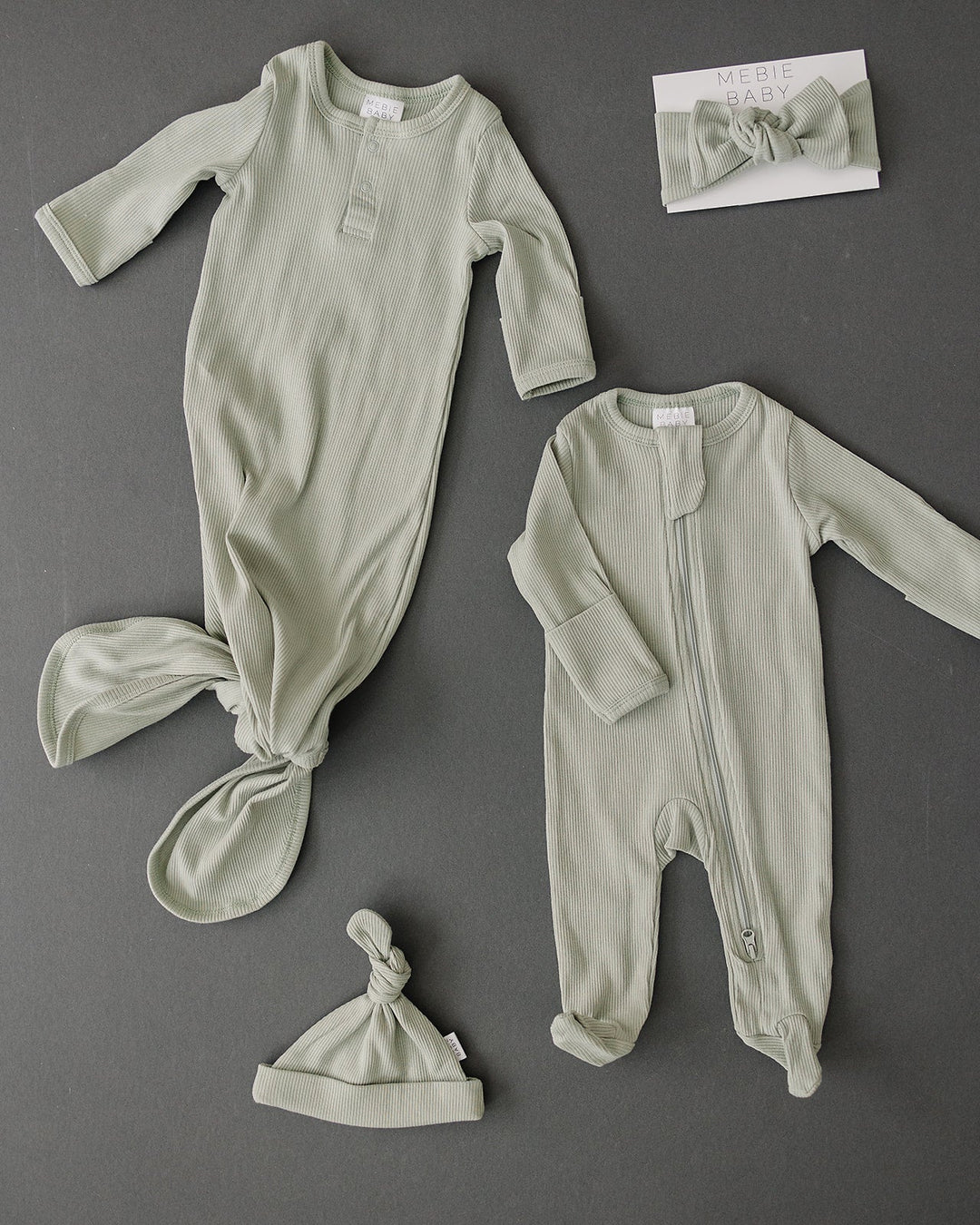Mebie Baby Sage Organic Cotton Ribbed Zipper shown up close to highlight the snap or zip detail.