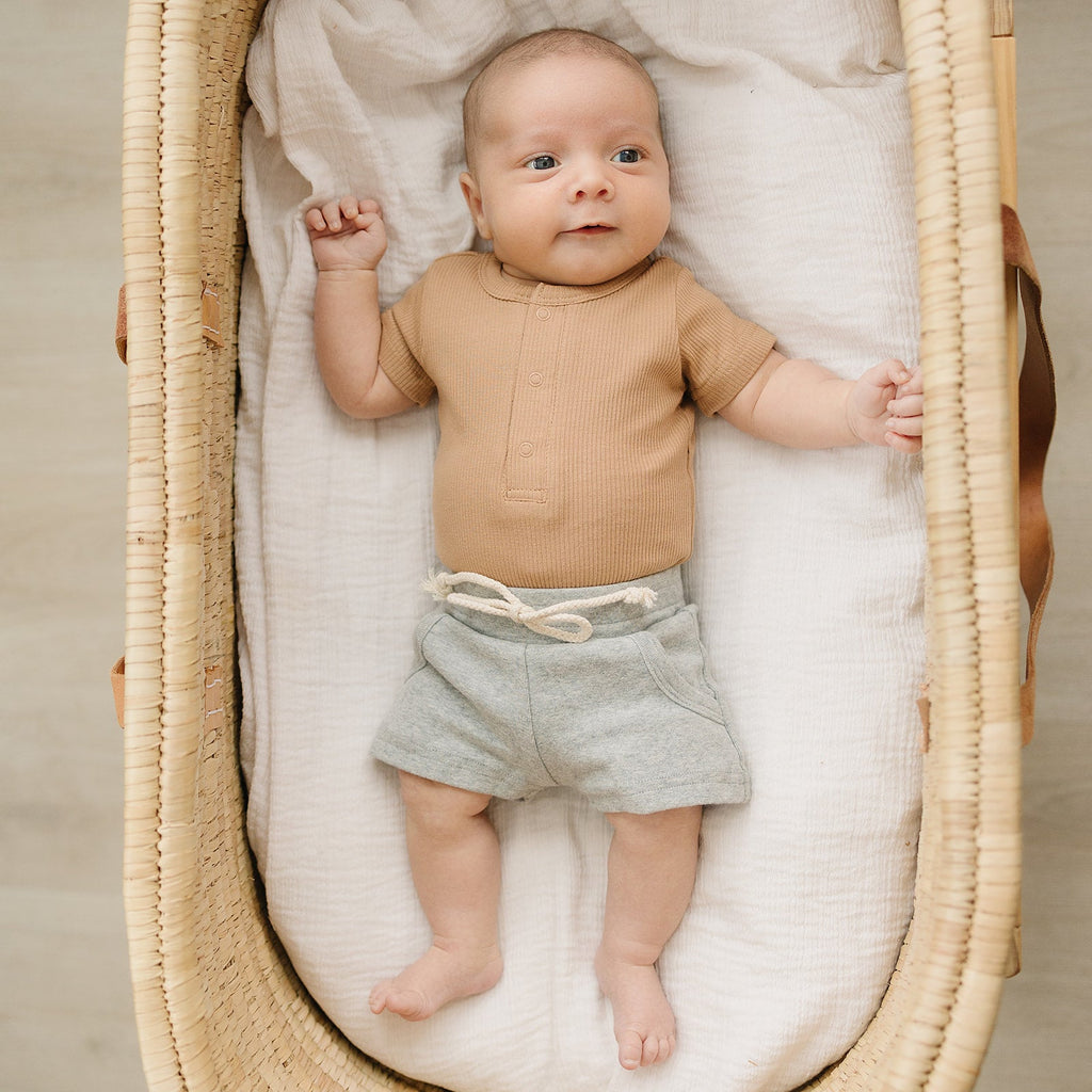 Organic cotton snap bodysuit, made by Mebie Baby