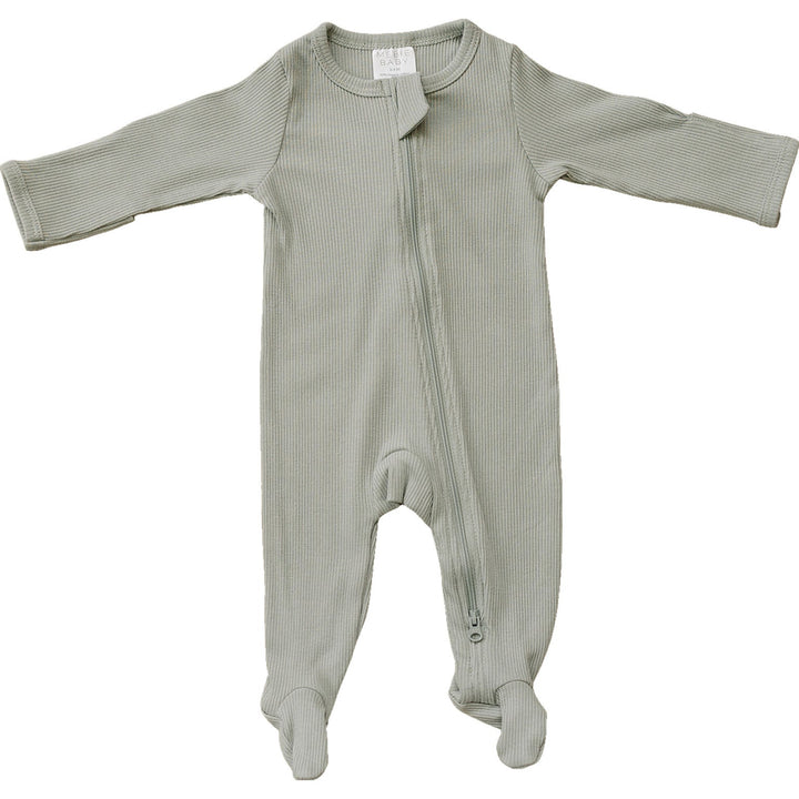 Sage Organic Cotton Ribbed Zipper by Mebie Baby, worn by a baby on a play mat.