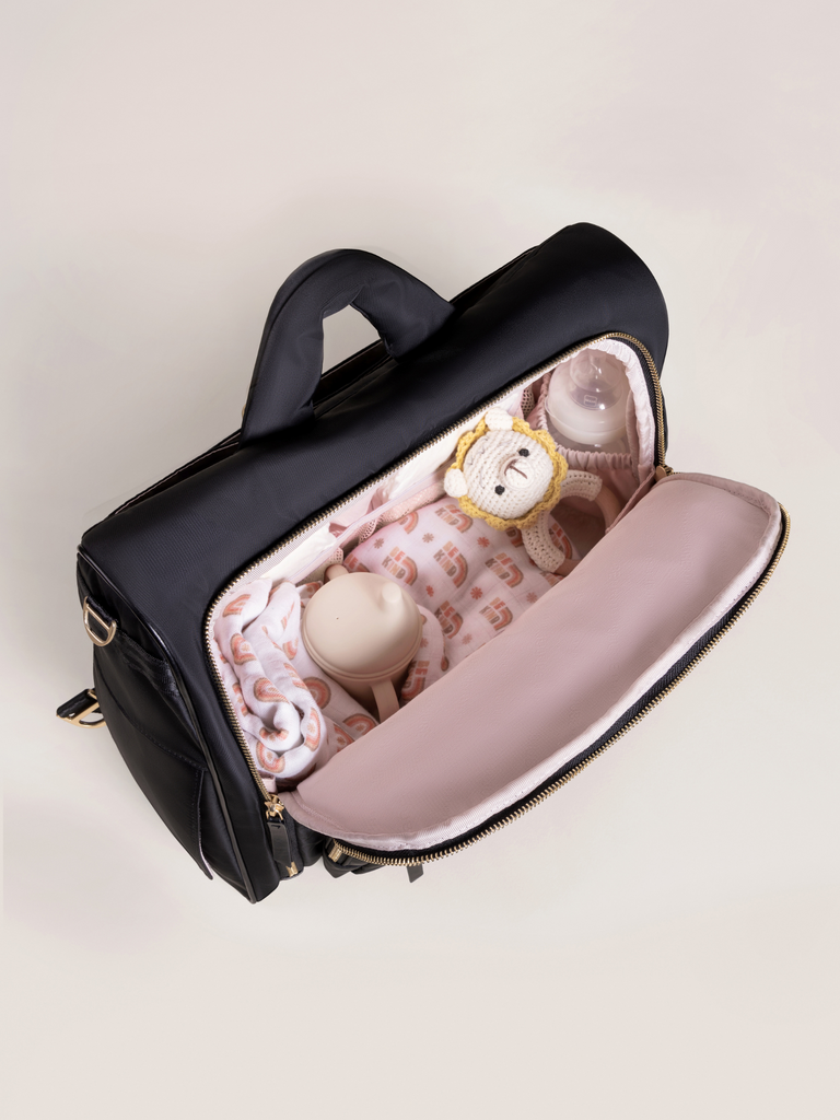 Removable stroller straps on the JuJuBe Diaper Satchel for hands-free convenience