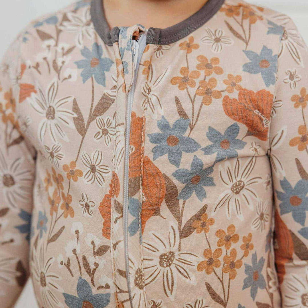 Close up of Copper Pearl Eden zipper and neckline detail, baby pajamas designed for easy diaper changes