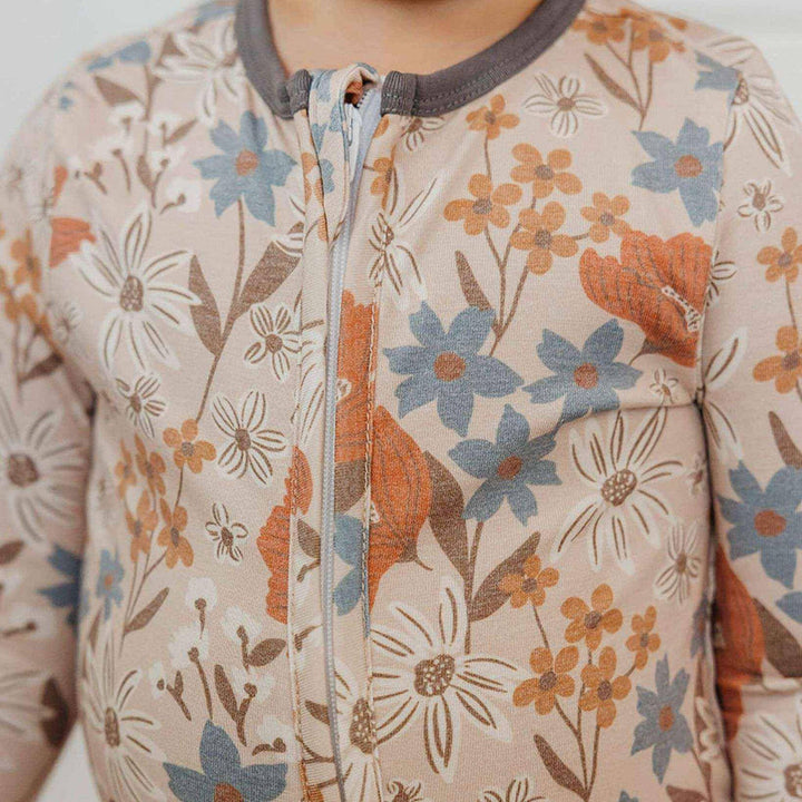 Close up of Copper Pearl Eden zipper and neckline detail, baby pajamas designed for easy diaper changes
