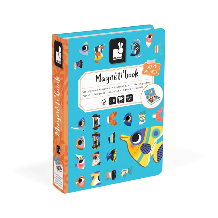 Child holding a magnetic toys fish piece from Janod Magneti'book