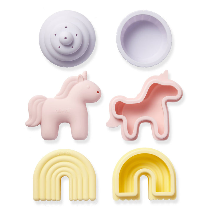 Ali+Oli unicorn rainbow cupcake silicone bath toys styled on beach sand aesthetic toddler bath toy set
