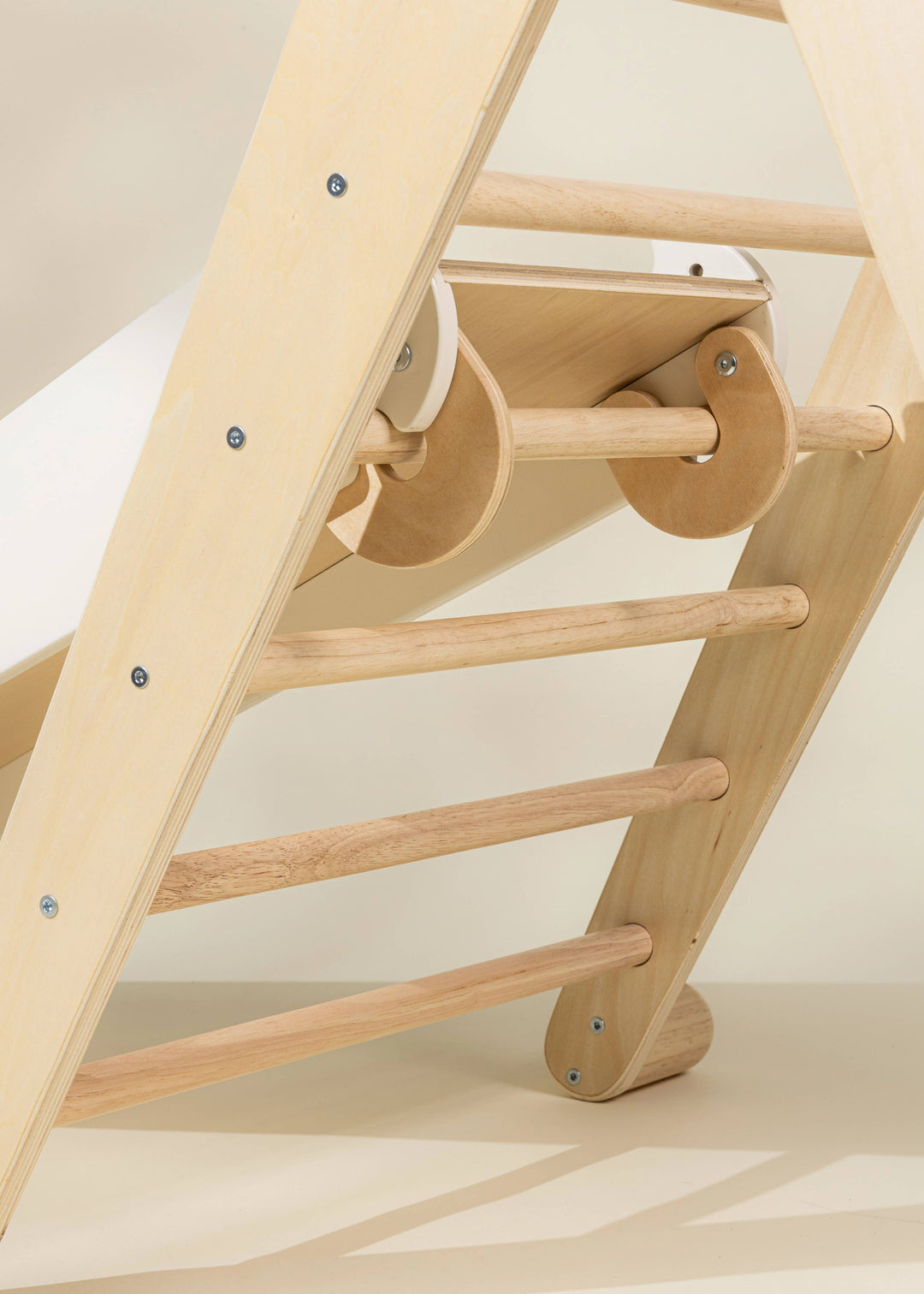 Balance and coordination shine in the Coco Village Montessori 2-in-1 Grip Climber Board & Slide in Natural, a go-to for organic play.
