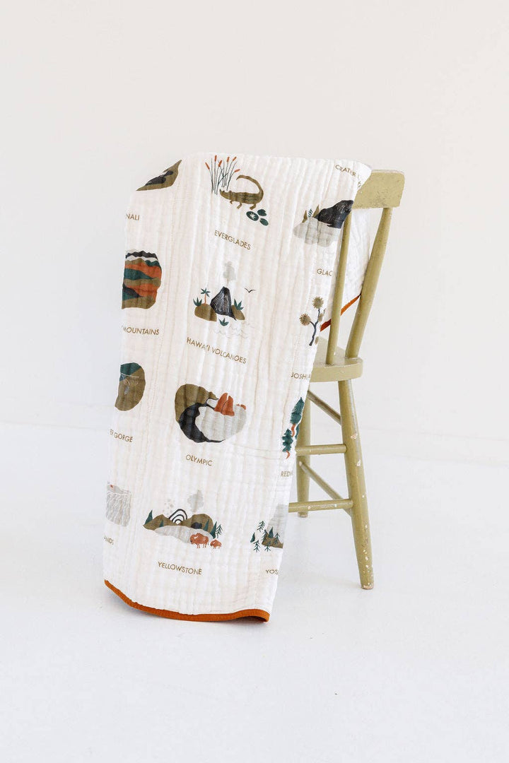 This Clementine Kids National Parks II Quilt doubles as a baby blanket with breathable, soft muslin fabric.