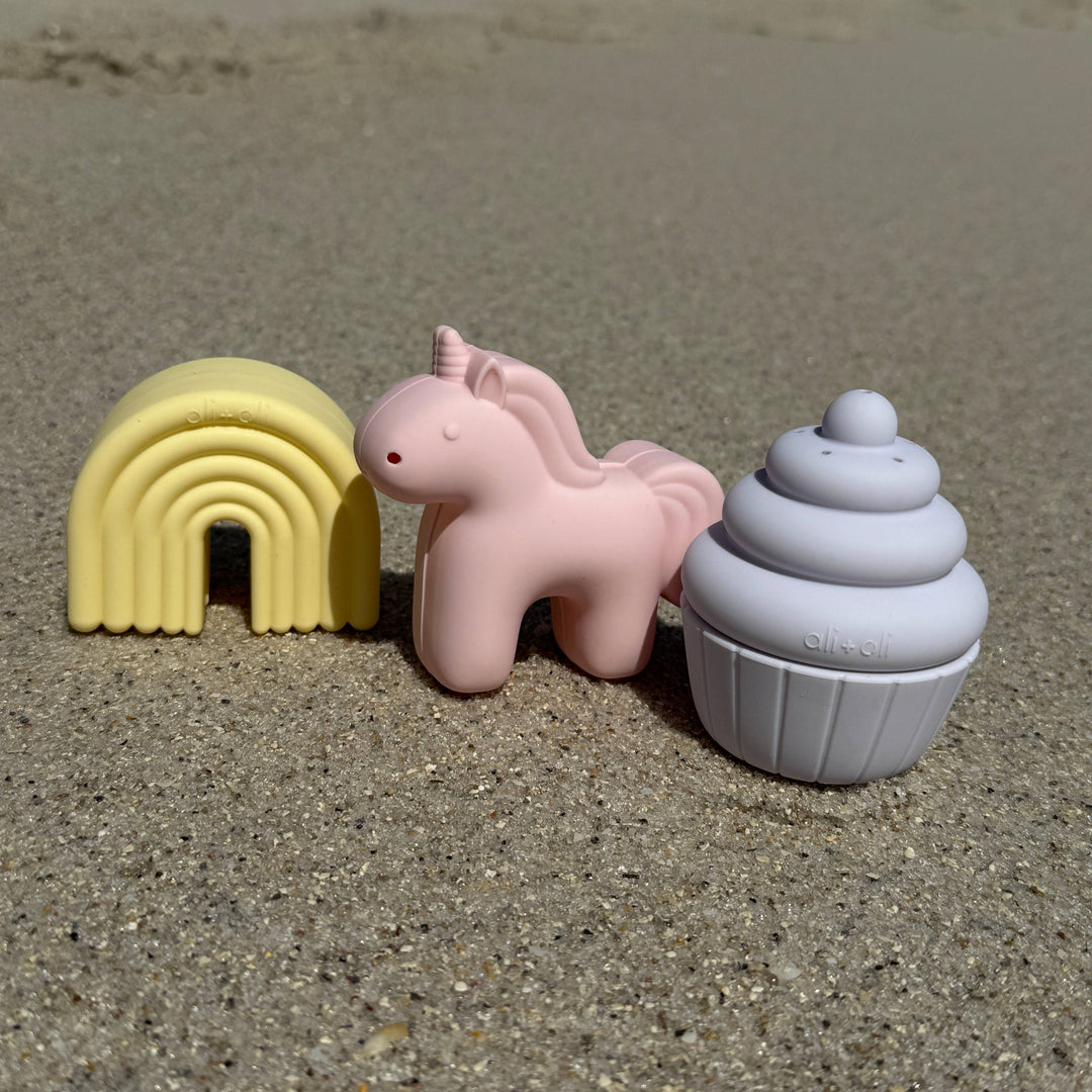 Ali+Oli unicorn rainbow cupcake bath toy set outdoor lifestyle photo showing silicone bath toys for baby sensory play