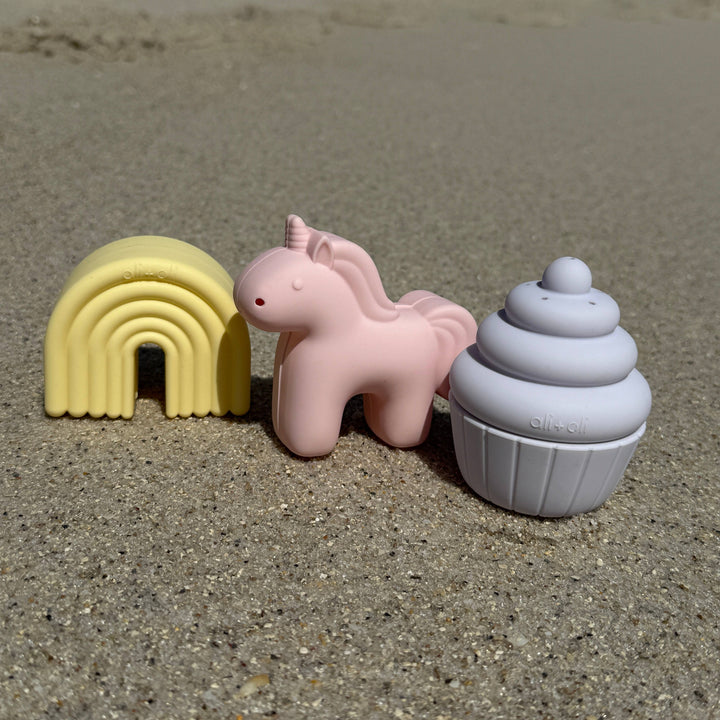 Ali+Oli unicorn rainbow cupcake bath toy set outdoor lifestyle photo showing silicone bath toys for baby sensory play