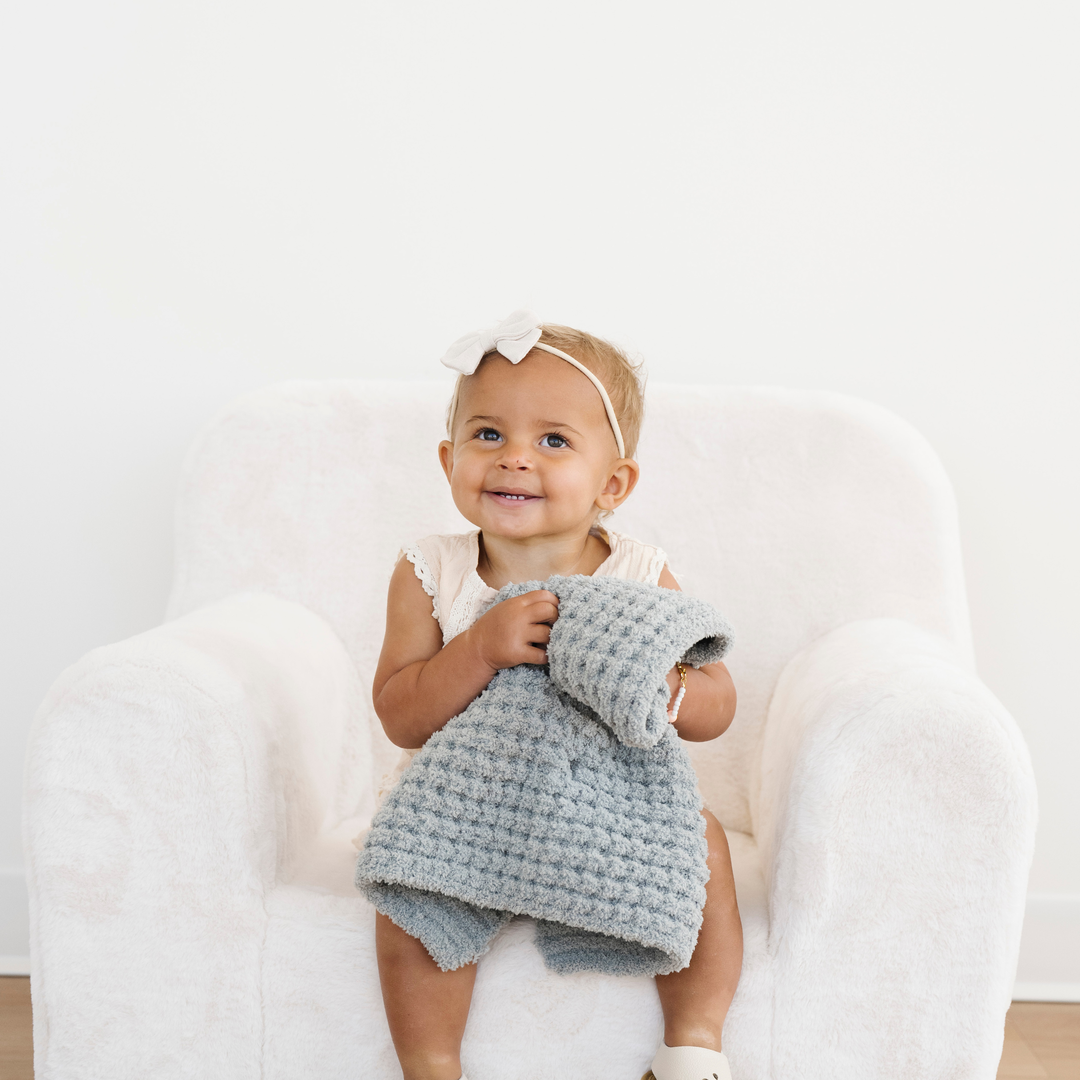 The Elm Saranoni Waffle Knit Mini Blanket keeps things cozy and elevated for Baby girl blankets moments.