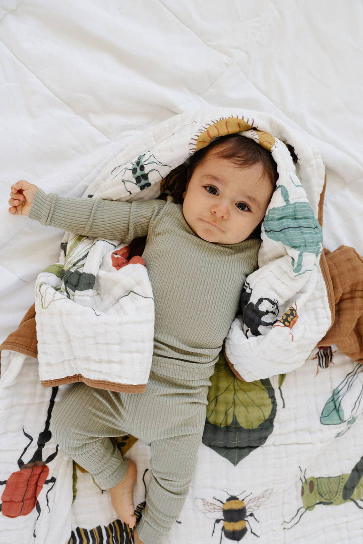 Clementine Kids Cutie Crawlies Quilt folds into luxurious muslin blankets, ideal for warmth and nursery charm.