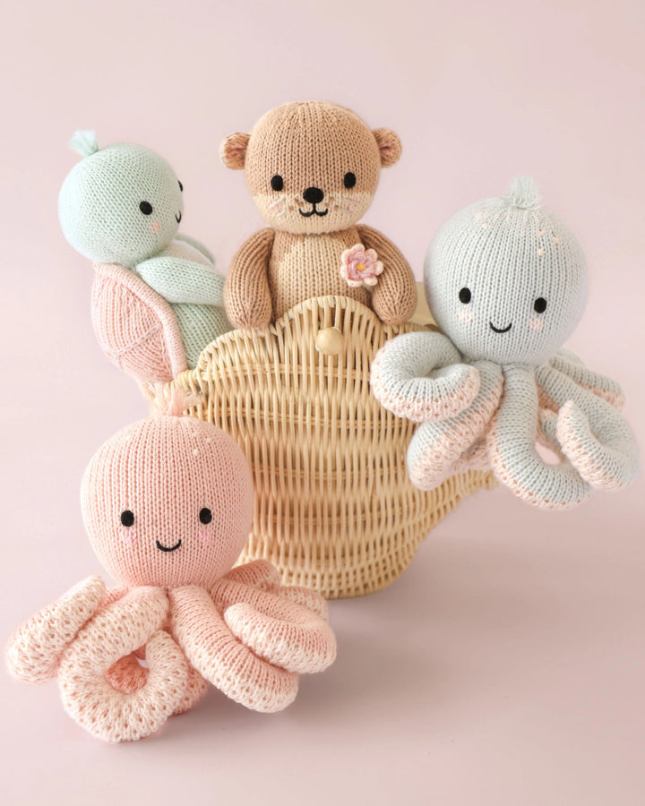 Placed neatly on a nursery shelf, Cuddle + Kind Baby Sea Turtle stuffed animals complete the dŽcor