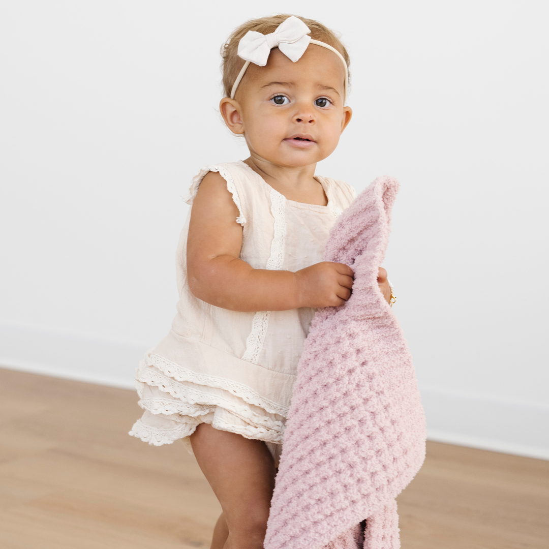 The Saranoni Waffle Knit Mini Blanket in Rosette adds refined warmth parents trust for Baby boy blankets.