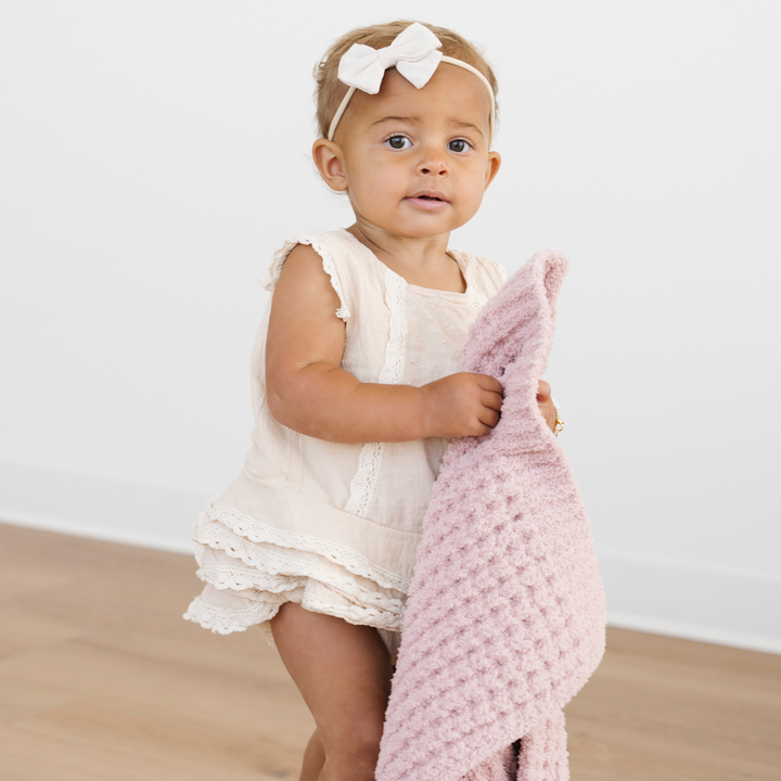 The Saranoni Waffle Knit Mini Blanket in Rosette adds refined warmth parents trust for Baby boy blankets.