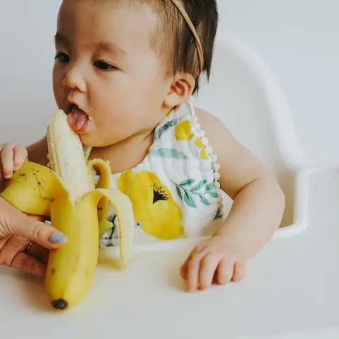 Beautifully designed Clementine Kids Buttercup Blossom Bib, combining comfort and style in everyday bibs.