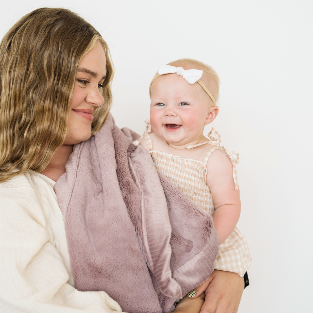 The Bloom Saranoni Lush Receiving Blanket wraps babies in warmth, making it a best blanket for toddler.