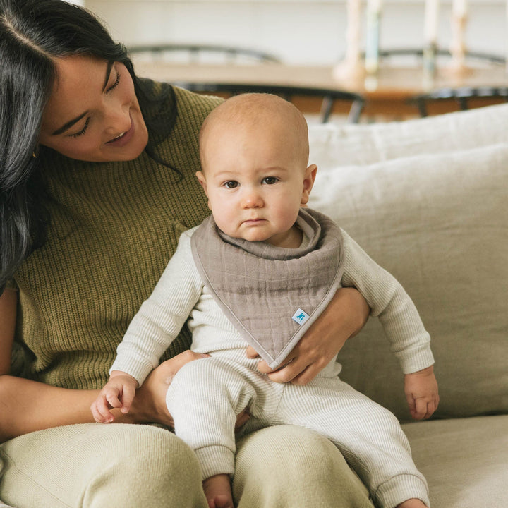 Little Unicorn Cotton Muslin + Fleece Bandana Bib 4 Pack - Adobe Checker shown on light background, elegant and comfy baby bibs.
