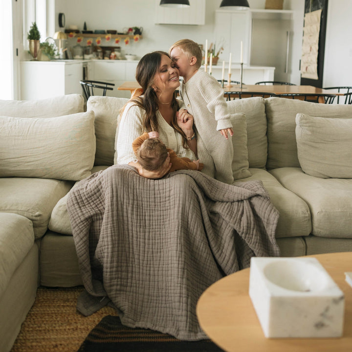 Cozy and stylish, the Little Unicorn Cotton Muslin Quilted Throw - Mocha serves as one of the best baby blankets