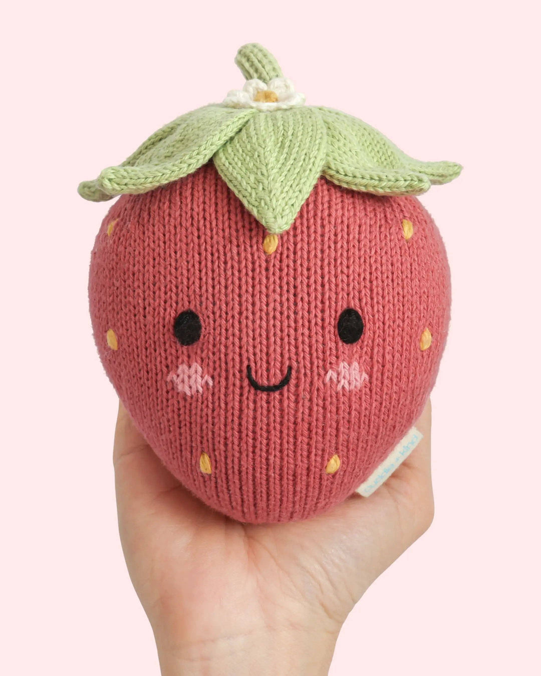 Hand-knit strawberry plush toy: Cuddle + Kind Baby Strawberry, a soft heirloom baby gift