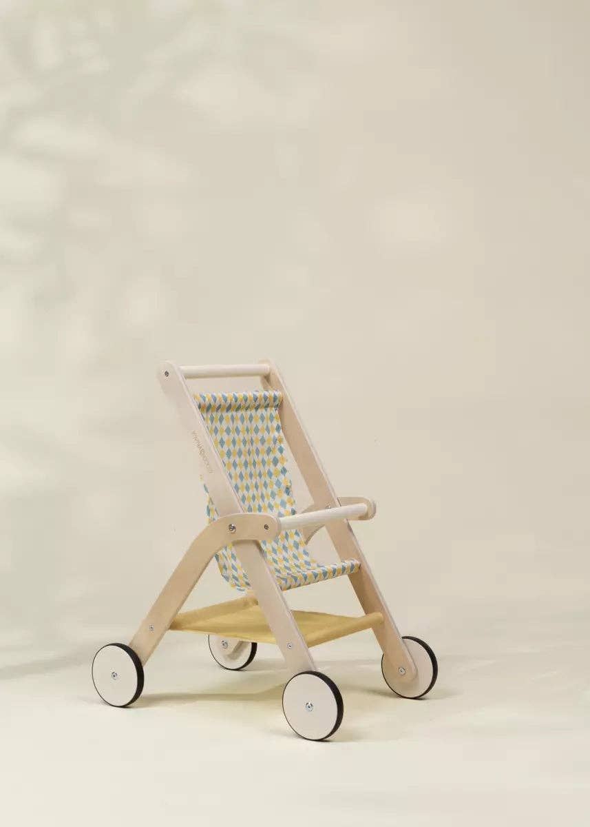 Side view of the Wooden Dolls' Stroller by Coco Village highlighting smooth wheels and wood frame