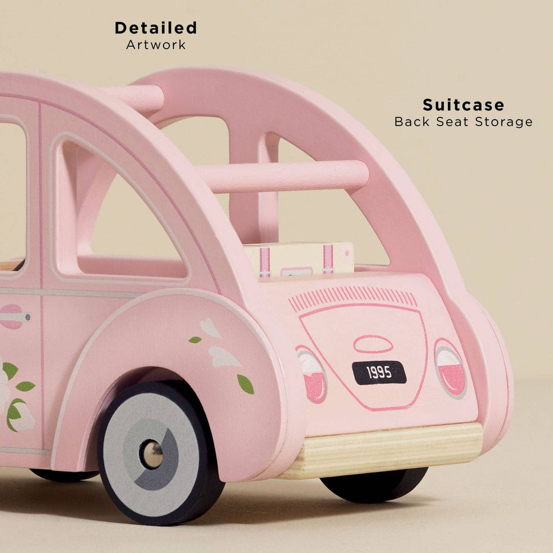Rear view of Sophie's Dolls House Toy Car from Le Toy Van showing detailed artwork and back seat suitcase storage