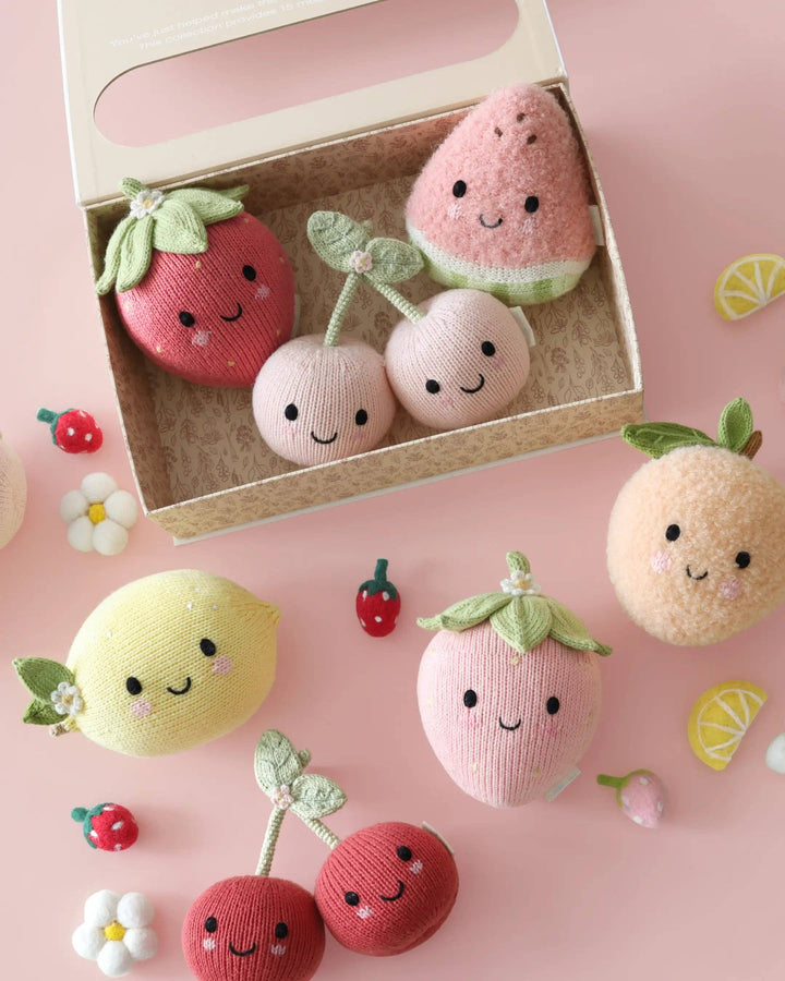 Heirloom strawberry plush toy by Cuddle + Kind: Baby Strawberry, hand-knit for newborns and up