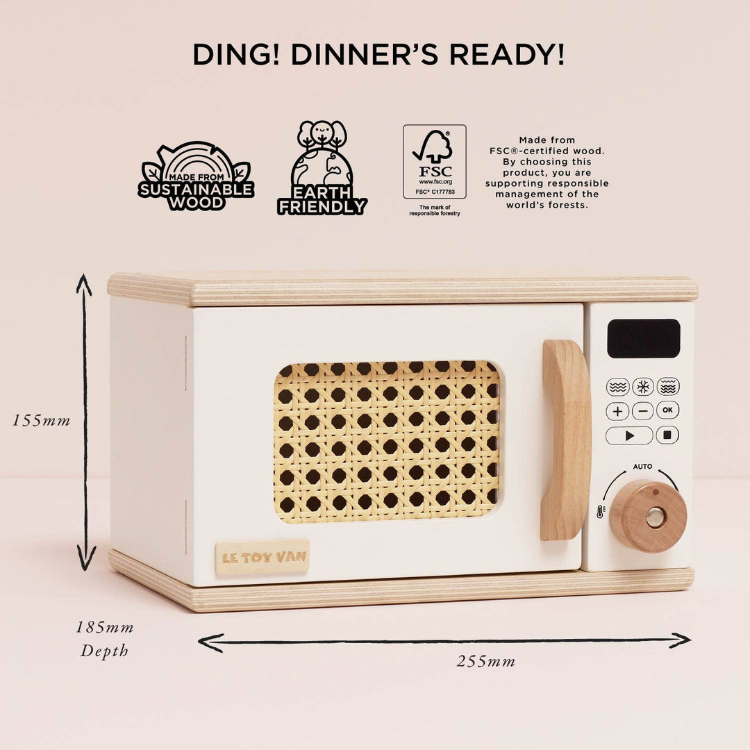 The Le Toy Van Wooden Microwave, a Montessori toy, inspires pretend cooking adventures.