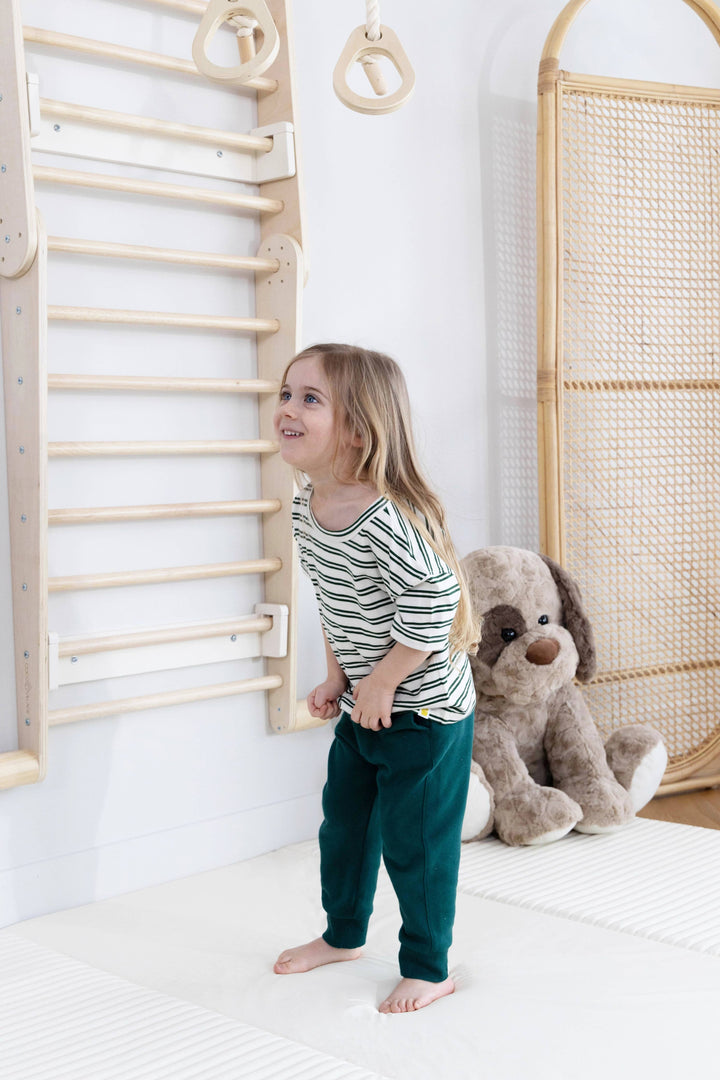 Play with purpose using the Coco Village Montessori 2-in-1 Triangle & Wall Climber in Natural wood, a sustainable and organic design.
