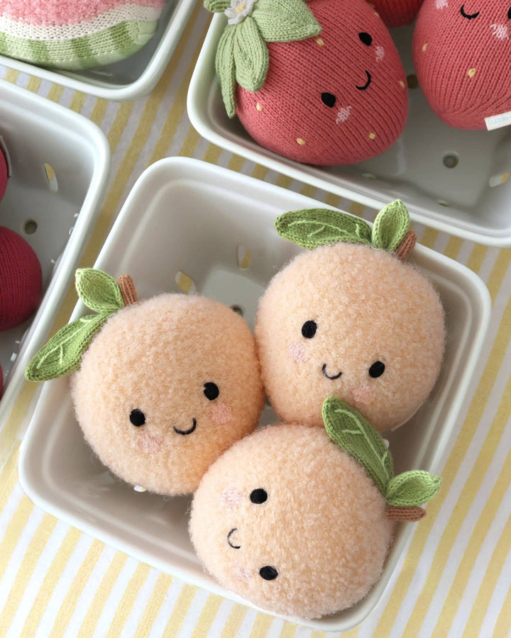 Baby Peach by Cuddle + Kind, a 7-inch knit fruit plush toy that gives 5 meals
