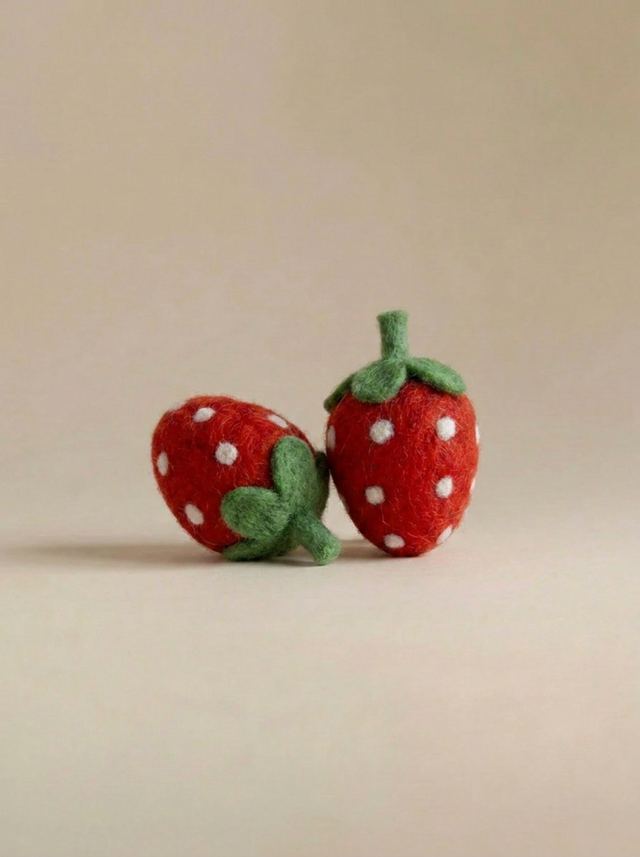 Close-up detail of Kaddu's Felt Strawberry showing handcrafted wool texture