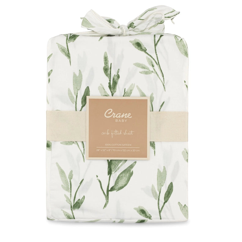 Parker Fitted Crib Sheet in Leaf from Crane Baby, with a fresh green leaf design. A stylish and soft choice for baby crib sheets.