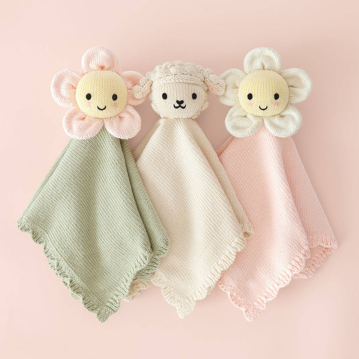 Cuddle + Kind Baby Daisy Lovey Blush closeup — heirloom quality knit lovey for newborn girls