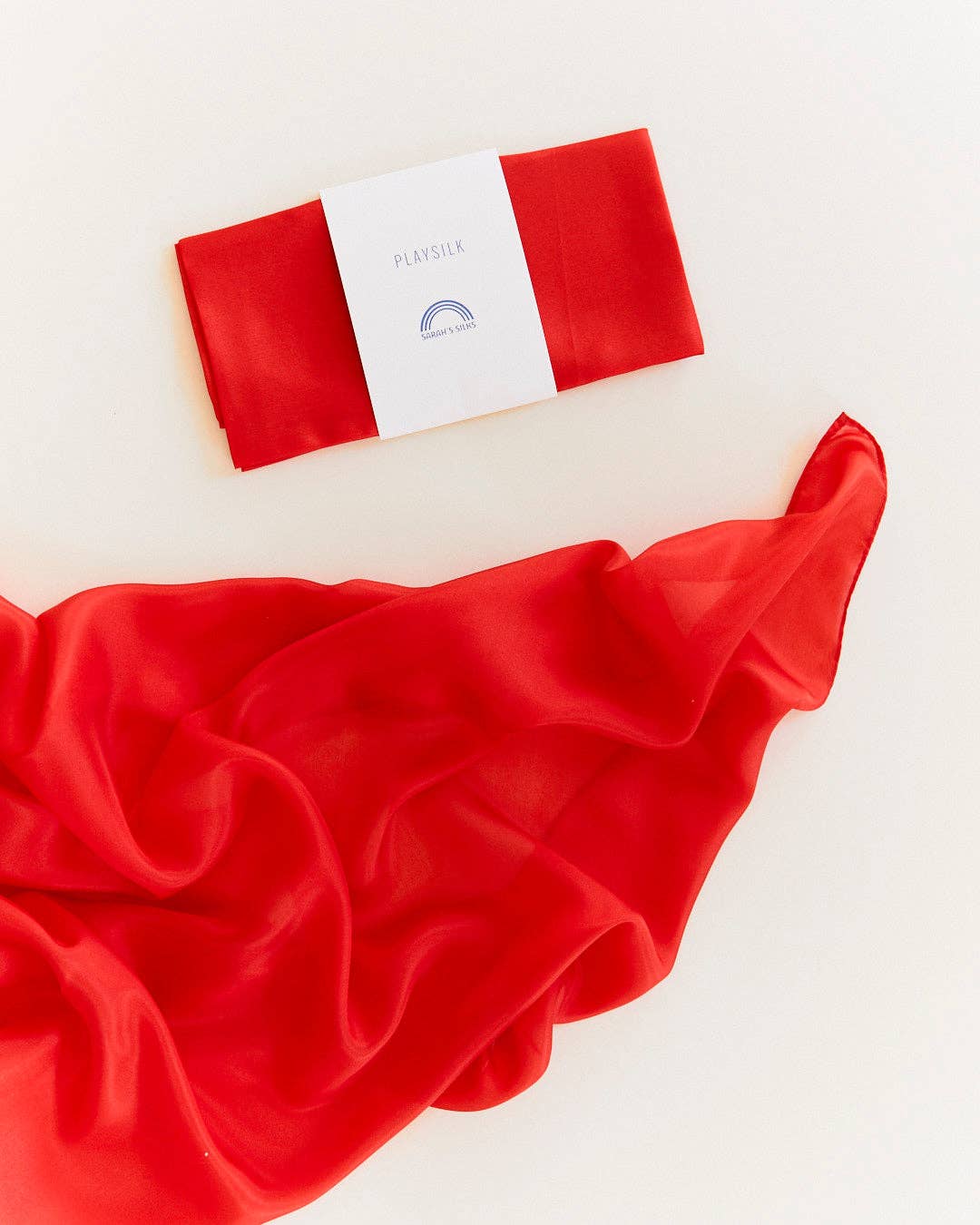 Red silk scarf flat lay, Sarah's Silks Solid Color Playsilks, a cherished plaything