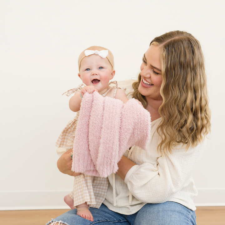Crafted for comfort, the Saranoni Bamboni¨ Receiving Blanket in Light Pink is a cozy favorite among baby girl blankets.