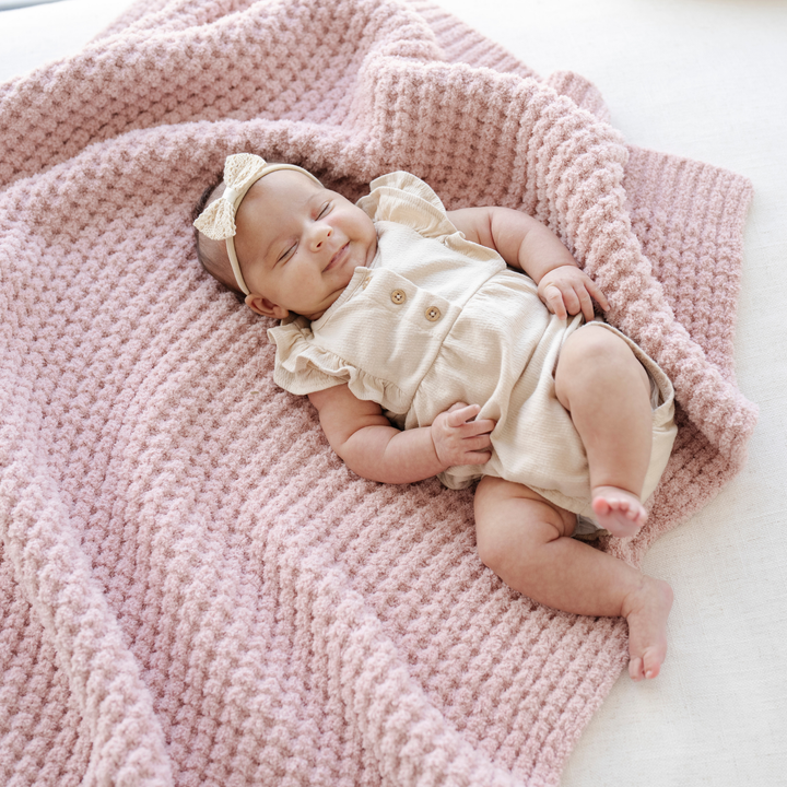 Keep baby warm with the Rosette Saranoni Waffle Knit Receiving Blanket, a knitted baby blanket loved by parents.