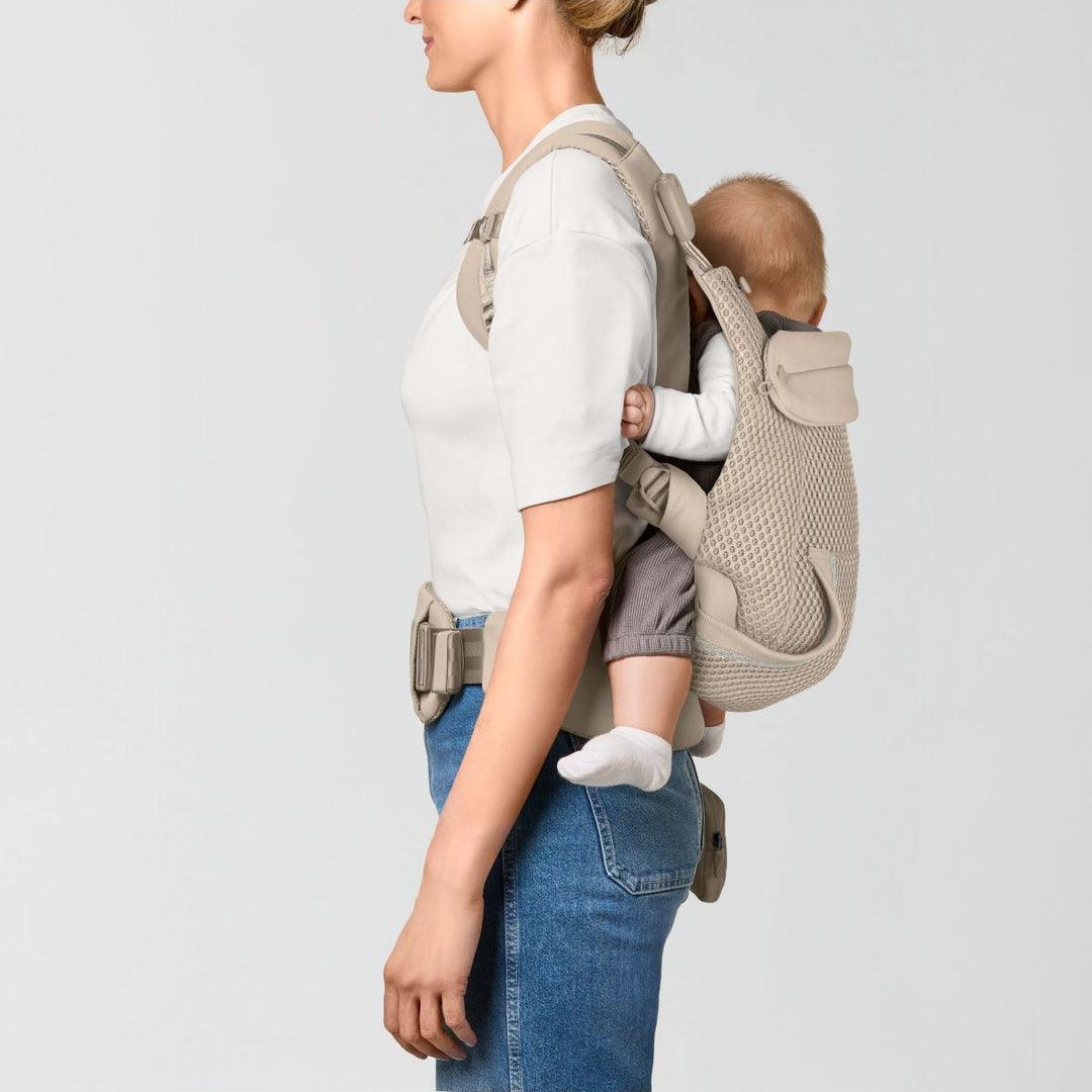 Cybex Laya Almond Beige flat lay – soft structured ergonomic carrier unfolded showing full construction