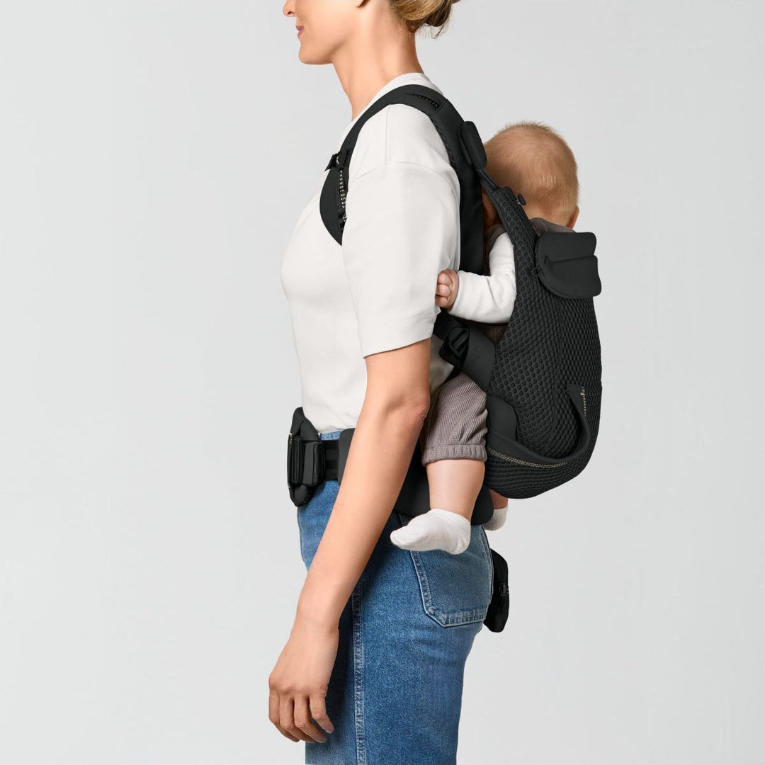 Cybex Laya Magic Black flat lay – soft structured ergonomic carrier unfolded showing full construction