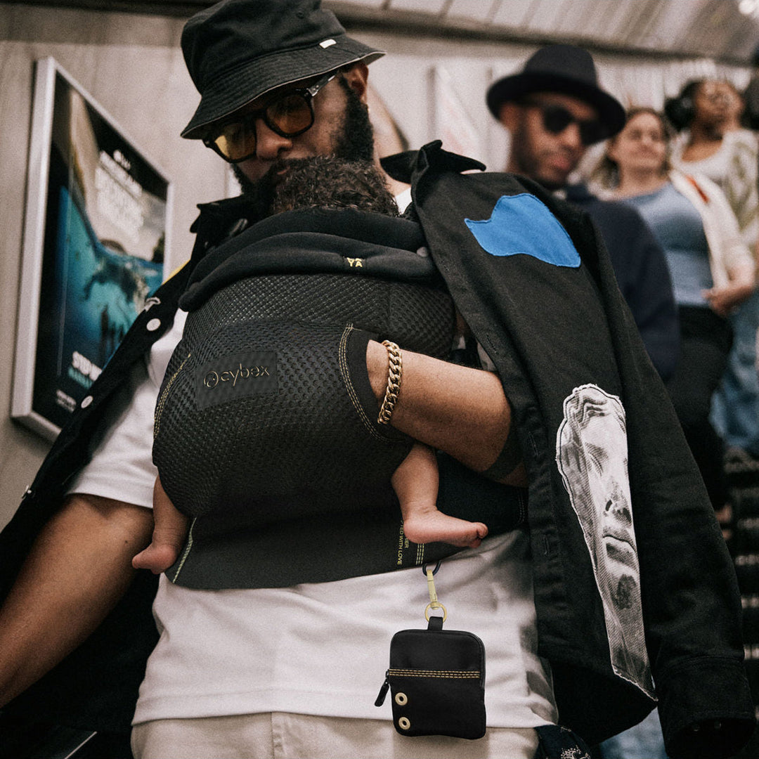 Cybex Laya Carrier Magic Black lifestyle worn – caregiver and infant showing comfortable carrier fit