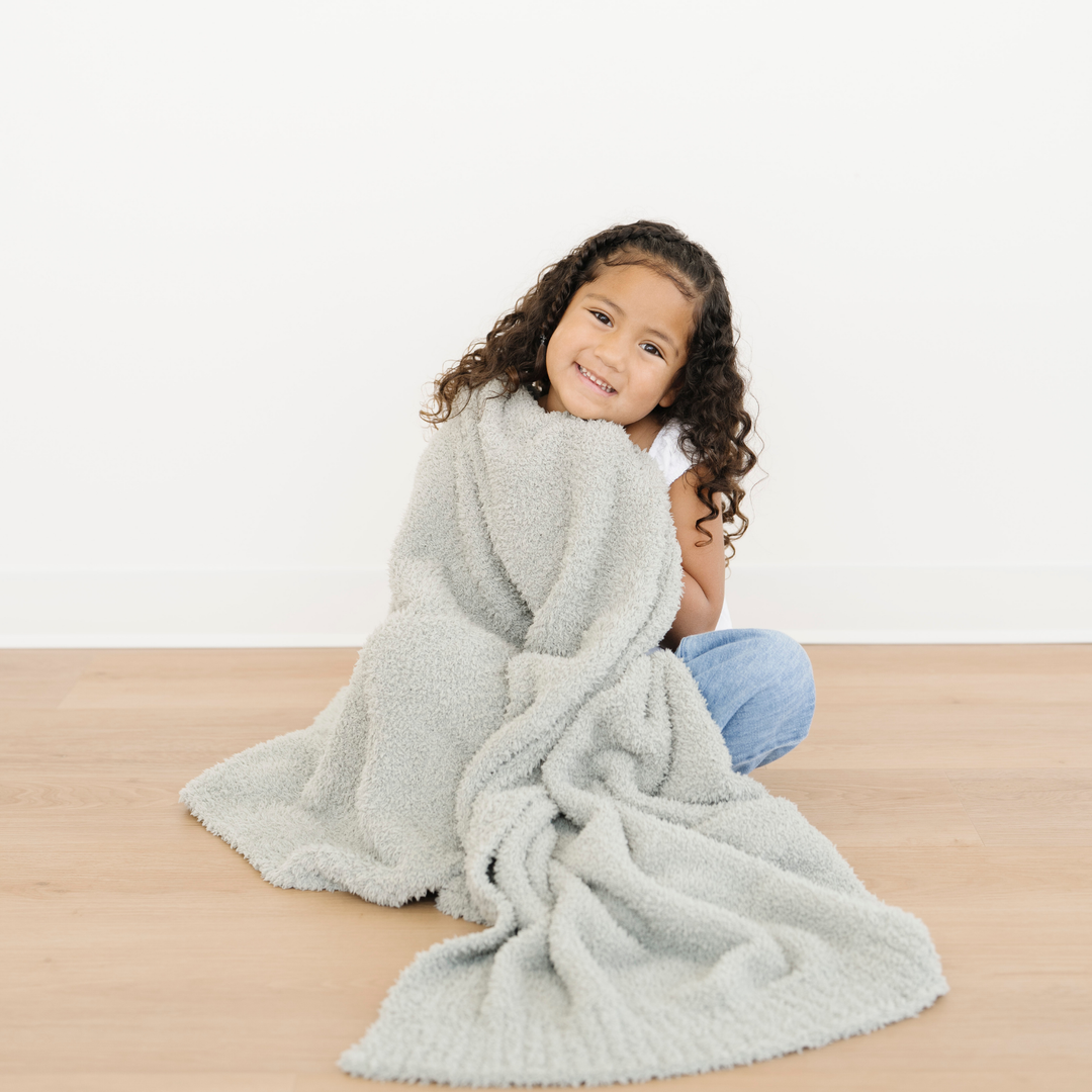 Ultra-soft Sage Saranoni BAMBONI¨ Toddler Blanket, perfect for warmth and comfort as a best baby blanket.