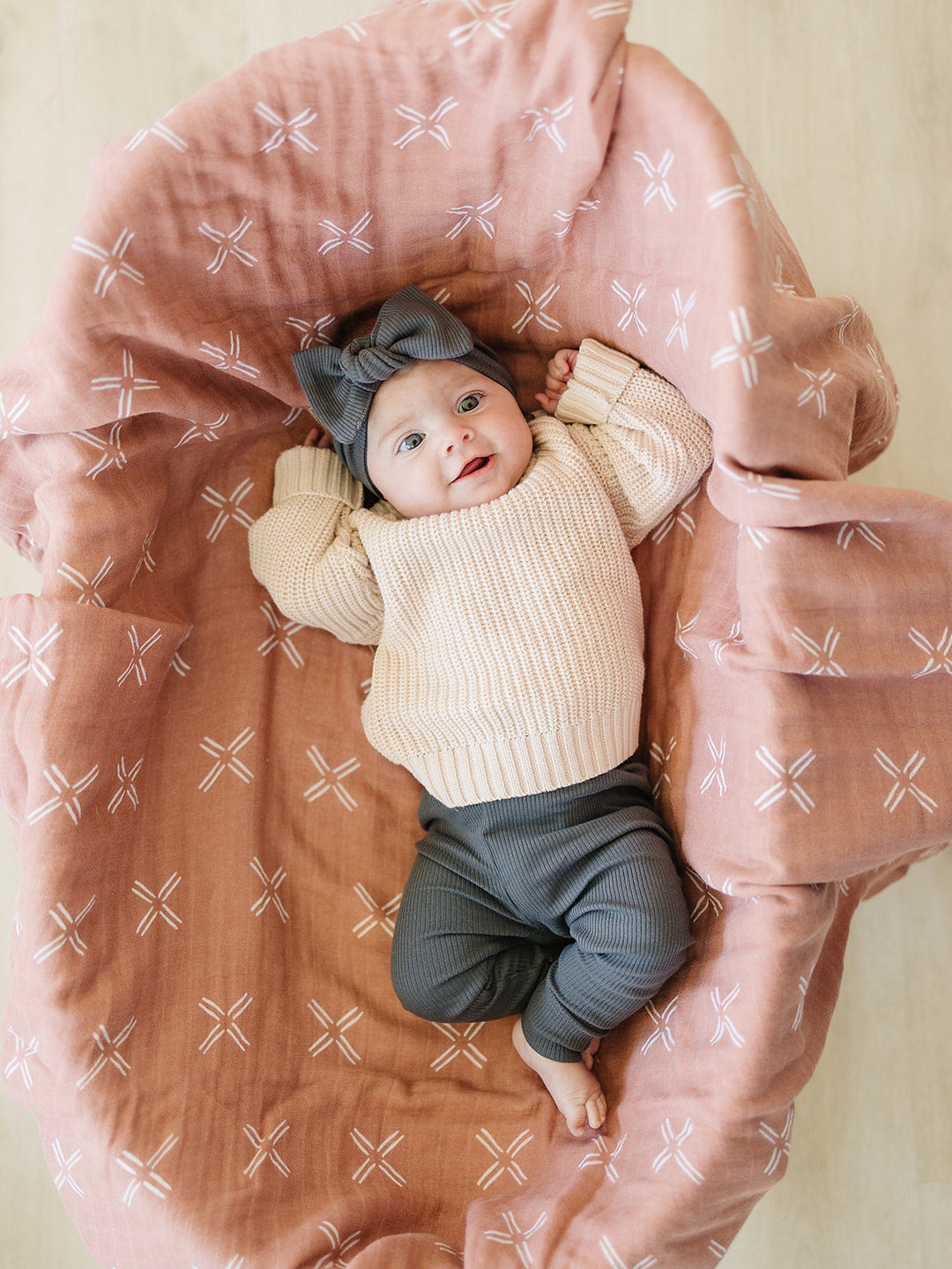 Charcoal Organic Leggings paired with a matching bodysuit, an organic cotton baby leggings with ribbed waistband.