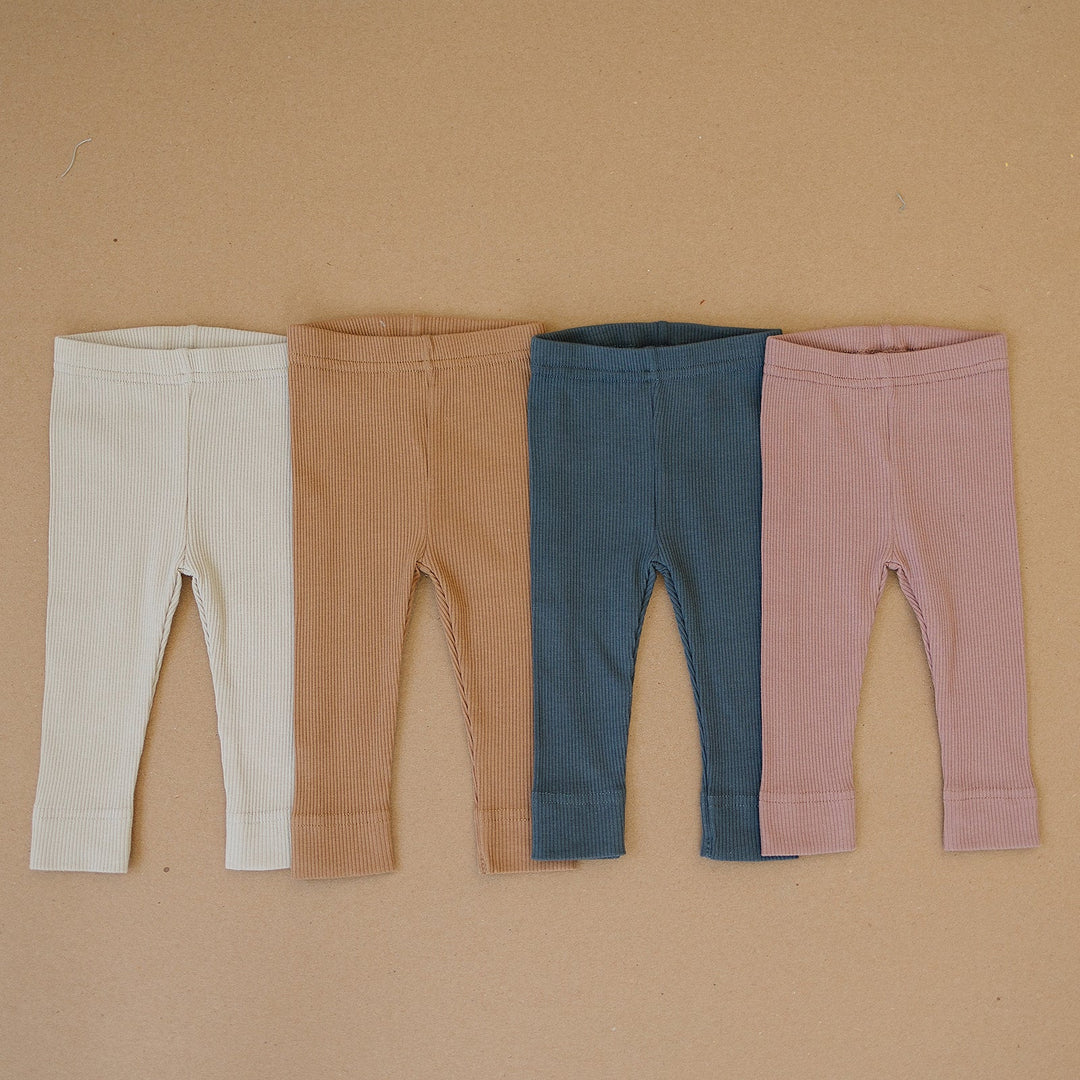 Mebie Baby Oatmeal Organic Leggings, soft stretchy pants made for crawling babies, laid flat to show the ribbed waistband.