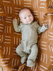 Baby wearing the green Mebie Baby cotton ribbed pajamas.