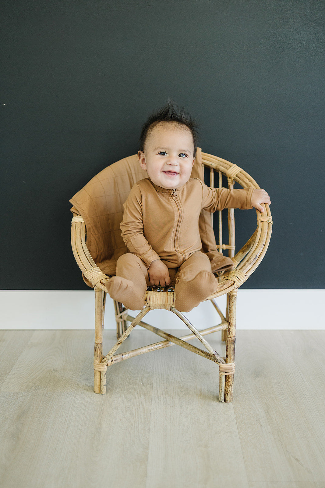 Mustard Bamboo Footed Zipper displayed to show sizing and fit details of this bamboo footie pajama